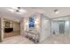 Stylish condo entryway with contemporary art and storage at 565 Sanctuary Dr # A203, Longboat Key, FL 34228