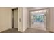 Bright and spacious condo entryway leading to living area at 565 Sanctuary Dr # A203, Longboat Key, FL 34228