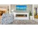 Elegant fireplace with modern design and stone surround at 565 Sanctuary Dr # A203, Longboat Key, FL 34228
