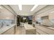Modern kitchen with marble countertops and breakfast nook at 565 Sanctuary Dr # A203, Longboat Key, FL 34228