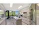 Modern kitchen with marble countertops and stainless steel appliances at 565 Sanctuary Dr # A203, Longboat Key, FL 34228
