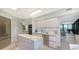 Modern kitchen with island, stainless steel appliances, and marble counters at 565 Sanctuary Dr # A203, Longboat Key, FL 34228
