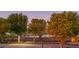 Landscaped grounds with pond and trees, providing a serene setting at 565 Sanctuary Dr # A203, Longboat Key, FL 34228