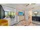Open living space with sliding doors to balcony at 565 Sanctuary Dr # A203, Longboat Key, FL 34228