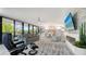 Open concept living space with fireplace and dining area at 565 Sanctuary Dr # A203, Longboat Key, FL 34228