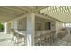 Relaxing poolside bar with seating for residents at 565 Sanctuary Dr # A203, Longboat Key, FL 34228