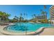 Inviting community pool with ample lounge space at 565 Sanctuary Dr # A203, Longboat Key, FL 34228