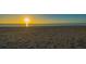 Footprints on a sandy beach during a sunset at 639 Cornwell On The Gulf, Venice, FL 34285