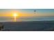 Scenic sunset over the ocean, a paraglider in the sky at 639 Cornwell On The Gulf, Venice, FL 34285