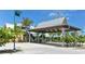 Covered parking area with tropical landscaping at 639 Cornwell On The Gulf, Venice, FL 34285