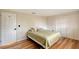 Bedroom with wood-look floors, built-in closet and window at 640 Venice Ln, Sarasota, FL 34242