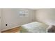 Simple bedroom with light walls and a window at 640 Venice Ln, Sarasota, FL 34242