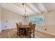 Bright dining room with chandelier and hardwood floors at 640 Venice Ln, Sarasota, FL 34242