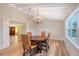 Bright dining room with chandelier and hardwood floors at 640 Venice Ln, Sarasota, FL 34242