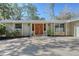 House exterior featuring a double wooden door at 640 Venice Ln, Sarasota, FL 34242