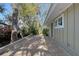 Stone patio with lush landscaping and access to the house at 640 Venice Ln, Sarasota, FL 34242