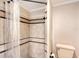 Shower stall with tiled walls and a clear shower curtain at 640 Venice Ln, Sarasota, FL 34242