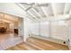 Sunroom features hardwood floors and large windows at 640 Venice Ln, Sarasota, FL 34242