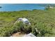 Aerial view of a home with a metal roof, nestled in a waterfront community at 707 40Th W St, Palmetto, FL 34221