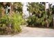 Gravel driveway leading to the property entrance at 707 40Th W St, Palmetto, FL 34221