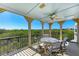 Spacious screened balcony offering scenic views and ceiling fan at 707 40Th W St, Palmetto, FL 34221