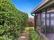 Landscaped backyard with lush greenery and a peaceful patio area at 7323 Oak Moss Dr # 42, Sarasota, FL 34241