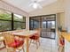 Cozy breakfast nook with access to a screened patio at 7323 Oak Moss Dr # 42, Sarasota, FL 34241