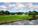 Community clubhouse near the golf course with a green roof at 7323 Oak Moss Dr # 42, Sarasota, FL 34241
