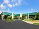 Community clubhouse with welcoming entrance and landscaping at 7323 Oak Moss Dr # 42, Sarasota, FL 34241