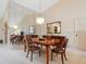 Formal dining room with wood table and chairs, and a large mirror at 7323 Oak Moss Dr # 42, Sarasota, FL 34241