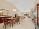 Spacious dining room with wood table, chandelier, and built-in hutch at 7323 Oak Moss Dr # 42, Sarasota, FL 34241