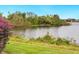 Scenic view of a lake with lush landscaping at 7323 Oak Moss Dr # 42, Sarasota, FL 34241