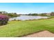 Scenic view of a lake with lush landscaping at 7323 Oak Moss Dr # 42, Sarasota, FL 34241