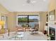 Spacious living room with fireplace and water views at 7323 Oak Moss Dr # 42, Sarasota, FL 34241