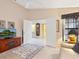 Living Room with a view into another room, comfortable couch, and a TV at 7323 Oak Moss Dr # 42, Sarasota, FL 34241
