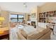 Spacious living room with lake view, fireplace, and ample seating at 7323 Oak Moss Dr # 42, Sarasota, FL 34241