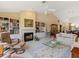 Open living room featuring a cozy fireplace and built-in shelves at 7323 Oak Moss Dr # 42, Sarasota, FL 34241