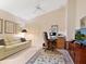 Bright office space with a comfortable sofa, a work desk and large TV at 7323 Oak Moss Dr # 42, Sarasota, FL 34241