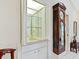 Small wet bar with sink, shelving, and bi-fold doors at 7323 Oak Moss Dr # 42, Sarasota, FL 34241