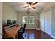 Bright home office features built-in desk, hardwood floors, and large windows at 931 Mangrove Edge Ct, Bradenton, FL 34208