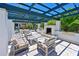 Relaxing outdoor pergola with fireplace and seating at 931 Mangrove Edge Ct, Bradenton, FL 34208