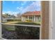 View of community clubhouse and grounds from screened lanai at 9481 Highland Oak Dr # 310, Tampa, FL 33647