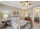 Cozy bedroom with a quaint bed and ensuite bathroom access at 1015 Calico Gln, Bradenton, FL 34212