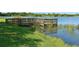 Community dock offering serene lake views and peaceful waterfront access at 1015 Calico Gln, Bradenton, FL 34212