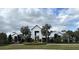 Modern community clubhouse with white exterior and metal roof at 11608 Little River Way, Parrish, FL 34219