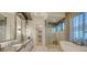 Spa-like bathroom with soaking tub and walk-in shower at 1206 Blue Shell Loop, Sarasota, FL 34240