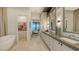 Double vanity bathroom with lake view at 1206 Blue Shell Loop, Sarasota, FL 34240