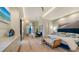 Bright bedroom with sitting area and large windows at 1206 Blue Shell Loop, Sarasota, FL 34240