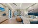 Spacious primary bedroom with sitting area and water views at 1206 Blue Shell Loop, Sarasota, FL 34240