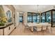 Bright dining room with modern chandelier and water views at 1206 Blue Shell Loop, Sarasota, FL 34240